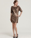 Gilded in shimmering sequins, this undeniably glam Trina Turk dress flaunts slit sleeves for a tasteful peek of skin.