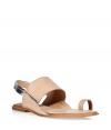 Channel easy elegance in these bold flat sandals from Diane von Furstenburg - Thick neutral leather front strap, metallic leather ankle strap, flat leather sole - Get the perfect resort-ready look with a caftan and a swimsuit or for city-ready chic with slim jeans and peasant top