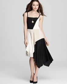 Take two trends for a twirl with this DKNY dress. Color blocking meets an asymmetric hem for of-the-moment style.