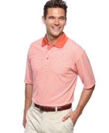 This short-sleeved golf polo from Champions Tour features performance fabric to keep you cool, dry and stylish out on the links.