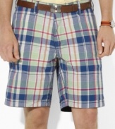 Ralph Lauren's reversible madras short offers the perfect option for ultimate preppy style with a classic navy chino short on one side and a vibrant madras pattern on the other.