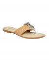 Soothing sparkles. Nine West's Seabreeze thong sandals brighten up any summer outfit.