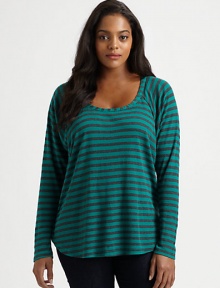 Classic stripes meet an undeniably feminine silhouette with athletic appeal. This raglan top goes perfectly with dark-denim jeans.ScoopneckRaglan sleevesCurved hemPull-on styleAbout 27 from shoulder to hemPolyester/micro modal/supima cottonMachine washMade in USA