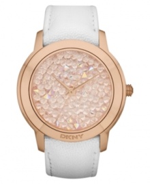 A fresh watch design from DKNY with eye-catching rosy-hued stones at the dial.