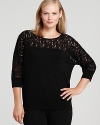 Brimming with dark romance, this DKNYC Plus top flaunts sheer lace detailing for a demure yet dramatic look.