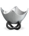 Set or simply decorate the table with the ultra-modern Anvil Scroll bowl from Nambe. A sculptural, iron-finished base cradles contoured silvertone alloy in this innovative Neil Cohen design.