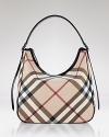 Exude uptown chic with this classic hobo style in Burberry's famous check.