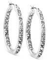 Glass crystals are always in-and out-in this pair of medium hoop earrings from Anne Klein. Crafted from silver-tone mixed metal. Approximate diameter: 1-3/4 inches.