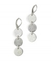 With a fun retro vibe, Jones New York's mod silvertone triple circle drop earrings are crafted from silver-plated mixed metal. Approximate drop: 2 inches.