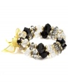 On the double. Two rows of fashionably faceted plastic beads adorn this stylish stretch bracelet from Jones New York. Made in gold tone mixed metal, the stretch design lets it slip on and off with ease. Item comes packaged in a signature gift box. Approximate diameter: 2-1/2 inches.