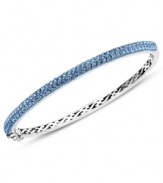 Slim, stackable style. Kaleidoscope's thin shimmering bangle makes a statement all its own, but can also be stacked with similar styles for a trendy layered look. Features round-cut blue crystals with with Swarovski Elements. Set in sterling silver. Bracelet features a hinge clasp. Approximate diameter: 2-1/2 inches.