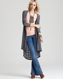 This long, but lightweight Free People crochet cardigan lends easiness to your weekend, layering the most laid-back styles with femininity and versatility.