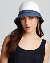 A woven cloche with colorblock detail and contrast woven band, a ladylike style with a modern twist.