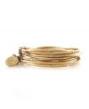 Accent your wrists with one gold bangle, or stack them as high as you please. Perfect the art of layering with these stackable bangles by Jessica Simpson. Each bangle features a row of seven round-cut crystal accents for an extra special touch. Crafted in worn gold tone mixed metal. Bangle set comes with a 3-inch attachment chain. Approximate diameter: 2-3/4 inches.