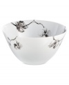 Compose a striking arrangement with the Black Orchid serving bowl by Michael Aram. Fine white Limoges porcelain flourishes under a dark watercolor motif inspired by foliage from around the world.