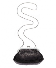 Simple yet stunning, this sequin bag by Calvin Klein is ideal for a chic night out on the town. Silver-tone accents and a concealable shoulder strap add versatility to this glamorous design.