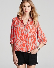 A fiery print alights upon this breezy silk blouse from Parker--perfect with your office basics or off-duty denim.