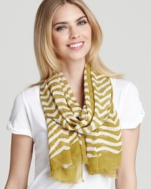 Stripes meet exotic influences in this stylish MARC BY MARC JACOBS scarf, set for any urban safari.