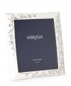 Show your romantic side. Loopy platinum hearts in white porcelain make the Love Story picture frame from Mikasa a beautiful way to display wedding or anniversary photos.