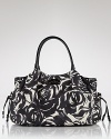 Abstract roses camouflage this baby bag with a grown-up print. Loaded with organizing features, it's as handy as it is chic. By kate spade new york.