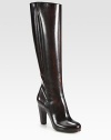 A raised silhouette of glossy leather with impeccable tailoring is simply elegant. Self-covered heel, 4 (100mm)Shaft, 17¼Leg circumference, 12½Leather upperSide zipLeather lining and solePadded insoleMade in France