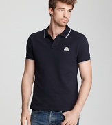 Classic polo with white stripe trim and embroidered logo at the left chest.