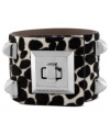 Animal magnetism. Vince Camurto designs this cuff bracelet with a snow leopard print and pyramid studs crafted from silver tone mixed metal. Finished with a turnlock closure. Approximate length: 8 inches.