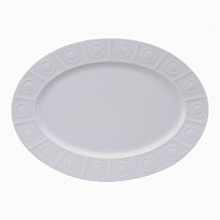 Modern in design with a raised circular pattern, made from French Limoges Porcelain. Dishwasher and microwave safe.