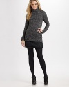 Exposed seams and ribbing add interest to this visually textural piece. Turtleneck Long sleeves with ribbed cuffs Pull-on style 56% cotton/44% wool Dry clean Imported 