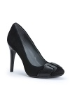 Calvin Klein keeps these high heel pumps fashion forward with toned-down, work-friendly covered platforms finished off with sophisticated leather buckles.