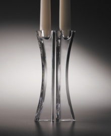 These crystal candlesticks designed by Karim Rashid for Nambé are the perfect accent for the sophisticated home. Clear crystal and an asymmetrical shape combine for modern elegance. Candles not included.