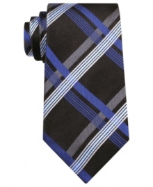 This cool patterned tie from Geoffrey Beene slims down to pair perfectly with your fitted shirt collection.