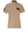 Stylish polo shirt in fine, pure tan cotton - A modern riff on a venerable classic from Ralph Lauren - Slim, straight cut - Small collar, short button placket and grommet detail - Oversize polo pony logo at chest and numbered sleeve - Hem hangs slightly longer in the back - Casually cool, ideal for everyday leisure - Pair with jeans, chinos or shorts