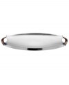 Polished aluminum alone makes Rivet serveware a standout, but with contrasting bronze handles and a sleek yet generously proportioned silhouette, this Dansk oval server embodies modern sophistication.