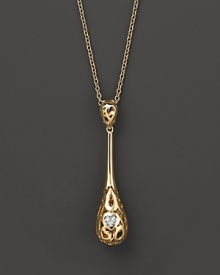 From the Mauresque collection, a teardrop lace-inspired pendant in 18 Kt. yellow gold with diamond pavé. With signature ruby accent. Designed by Roberto Coin.