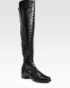 Head-turning boot of crocodile-embossed patent leather with an elasticized back panel for easy on and off access. Stacked heel, 1¾ (45mm)Shaft, 21Leg circumference, 13Crocodile-print patent leather with back elastic panelingPull-on styleLeather liningRubber solePadded insoleImported