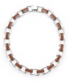 Industrial chic. This eclectic necklace from the Lauren by Ralph Lauren collection features heavy rectangular links in concert with a trendy leather band. Set in silver tone mixed metal. Approximate length: 18 inches.