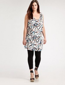 A festive print meets a design offering classic, draped details. This will be a figure-flattering tunic that you will love to wear with skinny jeans or leggings. Draped necklineSleevelessAllover printSelf-tie detail at backPull-on style About 37 from shoulder to hem94% venezia/6% spandexDry cleanMade in USA