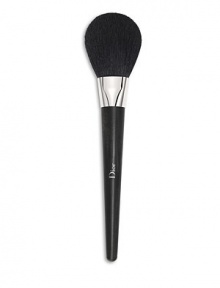 This brush features a supple, fluffy head made of natural, high-quality hair, allowing you to apply powders and powder foundations with the lightest touch possible. Its round shape holds powder and delivers the perfect amount to set makeup naturally, for a sheer, natural look. Made in France. 