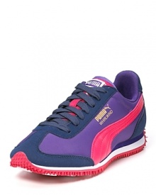 Classic pink and purple lace-up sneakers from Puma tout retro appeal with a signature side logo.