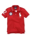 This preppy short-sleeve polo shirt in breathable cotton mesh celebrates Team USA's participation in the 2012 Olympics with the official U.S. Olympic Team logo and the Big Pony at front and London embroidery at the back.