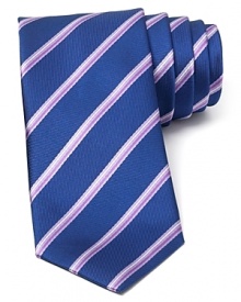 A perfect balance of classic and modern, with a handsome and traditional stripe pattern crafted with an on-trend skinny width, this tie transitions seamlessly from work to a downtown art opening or dinner with clients.