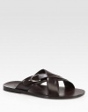 Leather criss-cross slide sandal with silver palladium hardware.Stirrup detailLeather soleMade in Italy