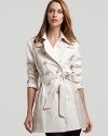 Contrasting panels lend subtle flair to this sophisticated double-breasted trench from DKNY.