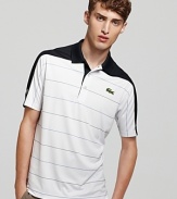 Get the court-ready look in a lightweight short sleeve striped polo with a thick contrasting stripe across the shoulders.