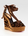 Slingback design of leopard-printed calf hair with leather trim, grosgrain ribbon laces and a chunky espadrille wedge. Calf hair and stacked rope wedge, 5½ (140mm)Stacked rope platform, 1½ (40mm)Compares to a 4 heel (100mm)Leopard-print calf hair upper with leather trim and grosgrain ribbonLeather liningSignaturee red leather solePadded insoleMade in Italy