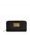 Stash away your most precious essentials in Marc by Marc Jacobs large black leather zip-around wallet, complete with an eye-catching logo plaque for a chic, covetable finish - Two inside sections with a zippered sectional coin pocket - Perfect for finishing sophisticated daytime looks