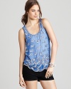 Silver beads and sequins decorate a pastel Aqua tank for a playfully chic look you can dress up or down.