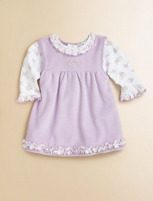 A lavender print, pima cotton bodysuit meets a ruffled jumper for a set as precious as baby. Bodysuit Ruffled crewneckLong sleeves with ruffled cuffsBack snapsBottom snaps Jumper CrewneckSleevelessBack snapsRuffled hemJumper: 80% cotton/20% polyesterPima cottonMachine washImported Please note: Number of snaps may vary depending on size ordered. 