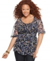 Blossom boho beauty with Fire's elbow sleeve plus size peasant top, featuring a babydoll shape and floral print.